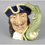A Royal Doulton character jug 'Captain Hook' D6597, the handle modelled as a crocodile and clock,