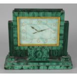 An early 20th century green malachite cased mantel clock, the rectangular dial with painted and