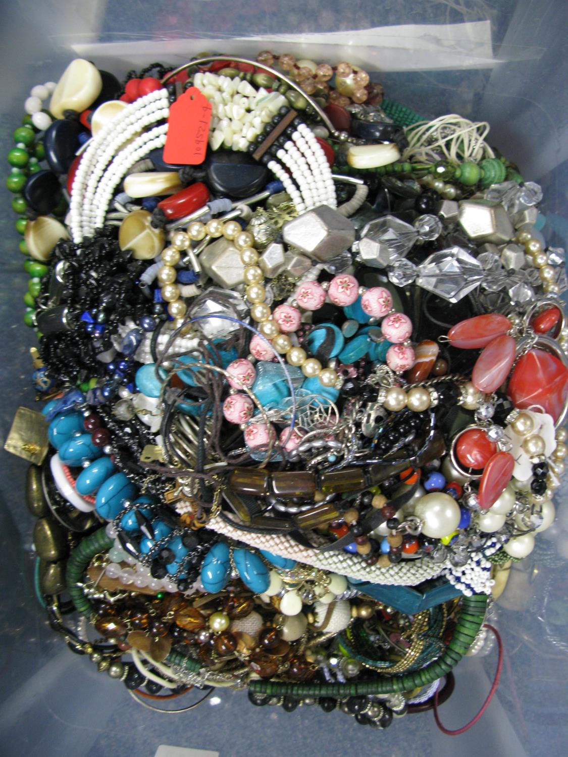 A bag containing a large quantity of costume jewellery. Many AF. Weight approximately 12kg. Due to - Image 2 of 2