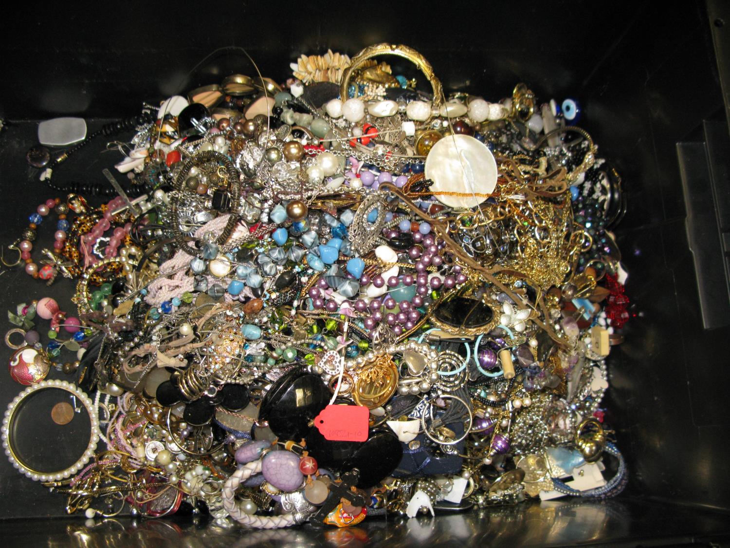 A bag containing a large quantity of costume jewellery. Many AF. Weight approximately 13kg. Due to - Image 2 of 2