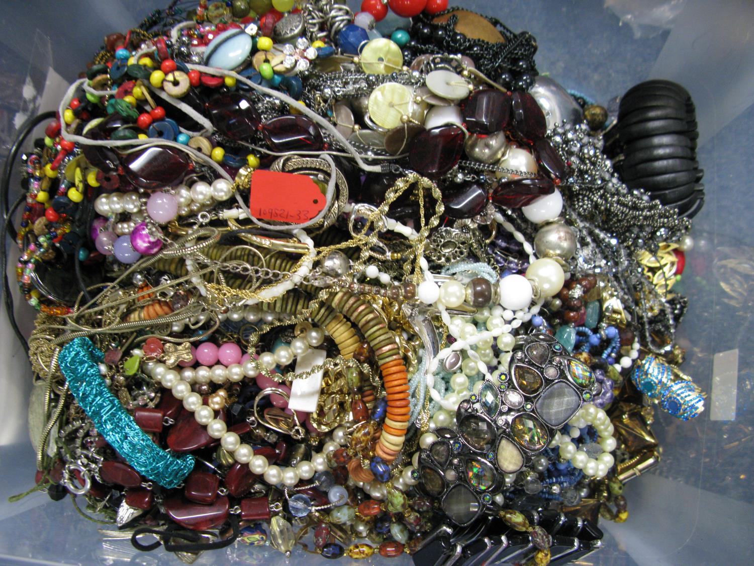 A bag containing a large quantity of costume jewellery. Many AF. Weight approximately 14kg. Due to - Image 2 of 2