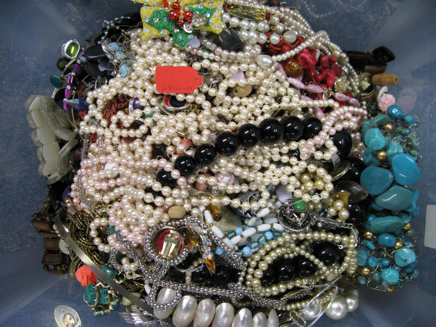 A bag containing a large quantity of costume jewellery. Many AF. Weight approximately 11kg. Due to - Image 2 of 2