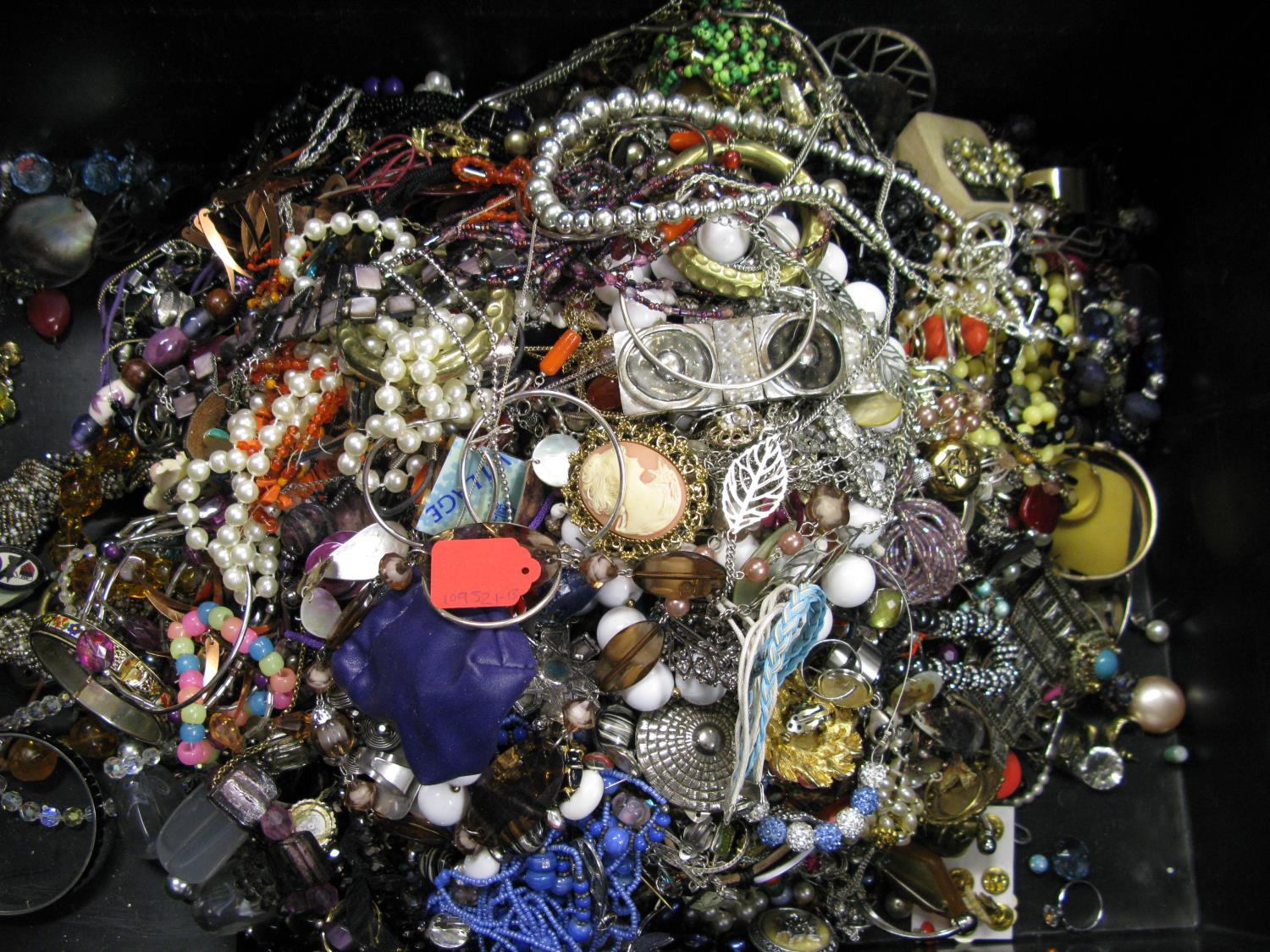 A bag containing a large quantity of costume jewellery. Many AF. Weight approximately 11kg. Due to - Image 2 of 2