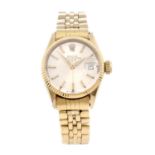 ROLEX - a lady's Oyster Perpetual Date bracelet watch. Circa 1960. 18ct yellow gold case with fluted