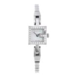 GUCCI - a lady's Mini G bracelet watch. Stainless steel case with white stone set bezel. Reference