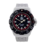 TAG HEUER - a gentleman's Formula 1 bracelet watch. Stainless steel case with calibrated bezel.
