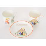 A 1930s Mabel Lucie Attwell for Shelley teacup and saucer decorated with a thatched cottage with a