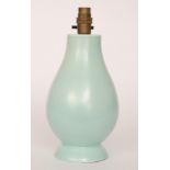 A Poole Pottery shape 673 lamp base of footed baluster form in a pale blue,