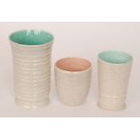 Three Poole Pottery vases of varying form,