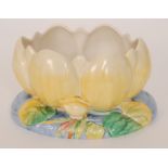 A Clarice Cliff Newport Pottery bowl formed as a yellow waterlily, printed mark,