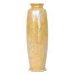 A Ruskin Pottery lustre glaze rolling pin vase decorated in a streaked yellow and blue glaze,