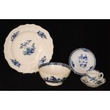 A late 18th Century Worcester coffee cup and saucer with feather moulding and blue floral sprays,