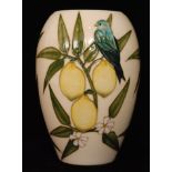 A Moorcroft Pottery vase decorated in the Finches and Lemon pattern designed by Sally Tuffin,
