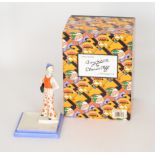 A later 20th Century Wedgwood Lido Lady after Clarice Cliff, hand painted in orange and blue,