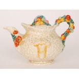 A Clarice Cliff Newport Pottery Celtic Harvest teapot with moulded decoration, printed mark,