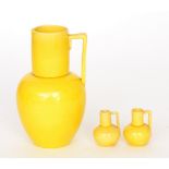 In the manner of Burmantofts - An early 20th Century yellow glazed ewer of bulbous form with an