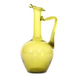 In the manner of Dr Christopher Dresser - Thomas Webb & Sons - An olive green glass ewer of ovoid