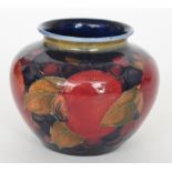 William Moorcroft - A small Pomegranate pattern vase decorated with a band of whole fruit and