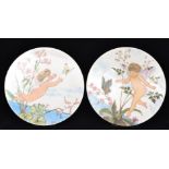 Mrs Horny - Unknown - A pair of late 19th Century earthenware circular wall plaques hand enamelled