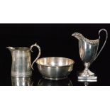 Three items of hallmarked silver, two cream jugs to include a helmet example,