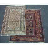 An early 20th Century Caucasian rug with three rows of guls on a rust ground,
