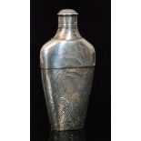 A Victorian hallmarked silver hip flask of flattened shouldered form chased with floral details and