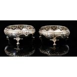 A pair of George V hallmarked silver circular bon bon dishes with pierced foliate border and fluted