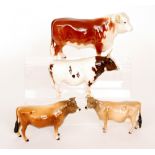 Four Beswick cattle comprising a Jersey Bull model 1422, a Jersey Cow Ch.