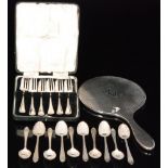 Ten hallmarked silver tea spoons with shell bowls and feather edged borders, London 1901,