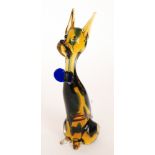 A 20th Century Murano glass figure of a sitting dog with applied decoration to the amber body all