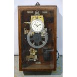 An early 20th Century mahogany cased wall mounted clocking in clock by the National Time Recorder