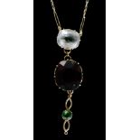 An early 20th Century 9ct garnet, peridot and clear paste pendant,