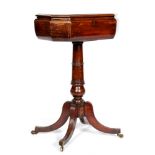 A 19th Century crossbanded octagonal mahogany teapoy on reeded splayed legs,
