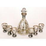 An early 20th Century Venetian drinks set comprising of a decanter of bell form with silvered