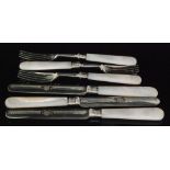 A set of twelve hallmarked silver and mother of pearl handled fruit knives and forks,