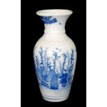 A Chinese blue and white baluster vase decorated with scenes of elders reading a scroll with tree