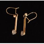 A pair of diamond pendant earrings each with illusion set brilliant cut diamonds to pendant bar