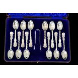 A cased set of twelve hallmarked silver tea spoons each with relief moulded foliate decorated
