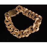 A 1970s hallmarked 9ct curb link bracelet composed of double textured links terminating with tongue