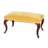 A mid 19th Century double seat rosewood stool upholstered in fawn on carved cabriole legs,