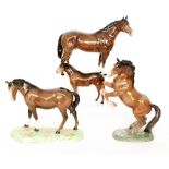 Four Beswick horse comprising a Welsh Cob (Rearing) model 1014, a Mare model 976,