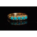 A 9ct hallmarked five stone turquoise head ring, claw set stones to a scroll decoration head,