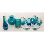 A group of Mdina glass to include a vase of cylindrical form with applied trail in clear crystal,