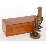 A late 19th Century brass adjustable microscope by Apps London fitted with adjustable lenses in
