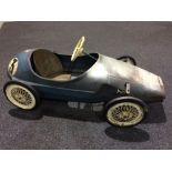 A Tri-ang pressed steel grand prix pedal car, possibly a Vanwall model, length 118cm,
