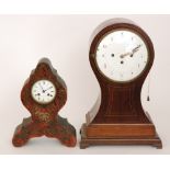 A large early 20th Century mahogany cased balloon mantle clock with eight day striking movement and