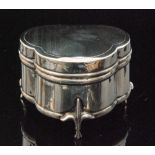 A George V hallmarked silver ring box of trefoil outline with engine turned design,