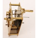 A brass four pillar single fusee anchor escapement wall clock movement.