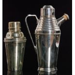 A mid 20th Century silver plated cocktail shaker of plain form with angular side handle and stepped