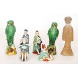 A Chinese Tang Dynasty style figure of an attendant together with four contemporary Chinese figures,